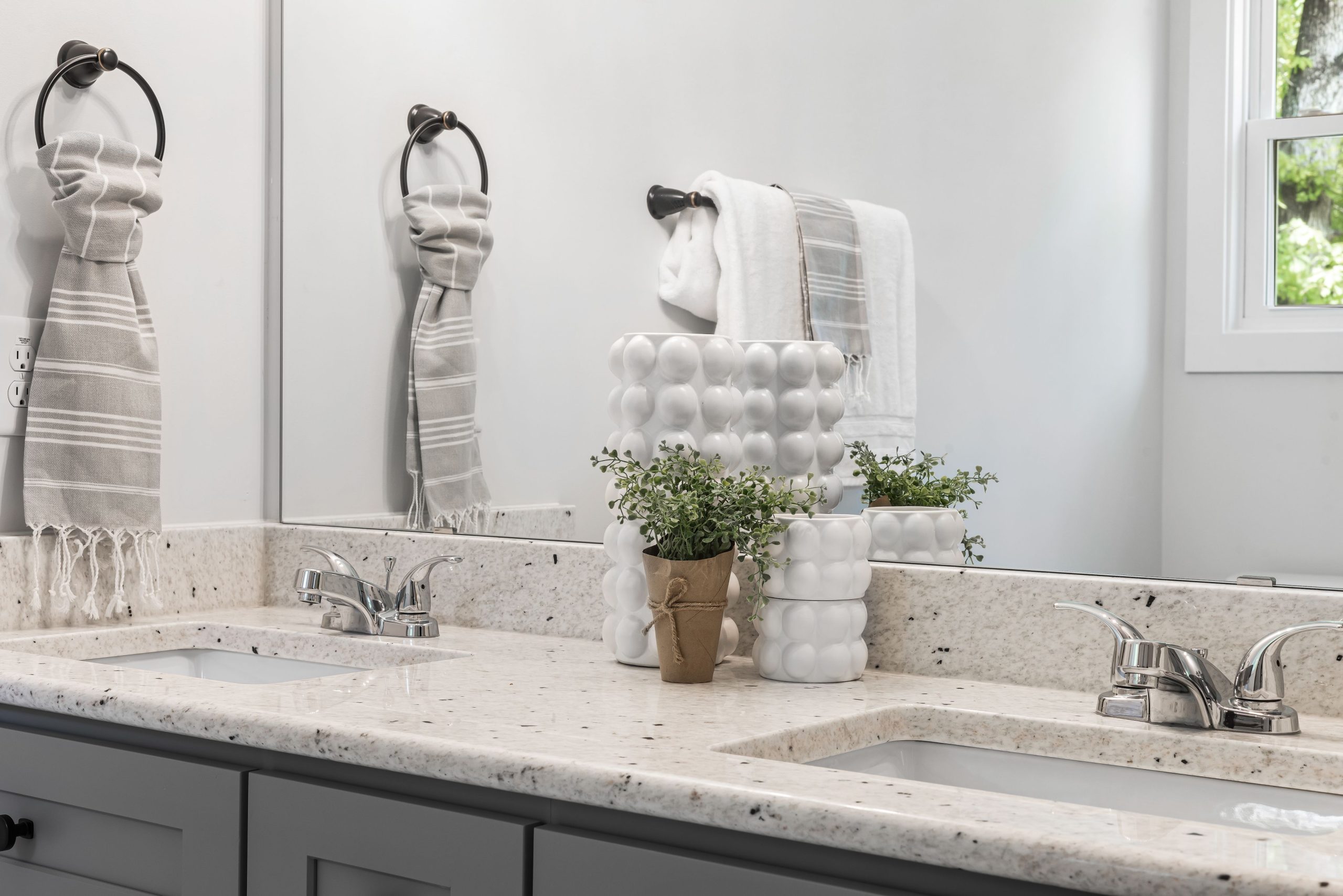 Bathroom vanity with sinks and mirror.
